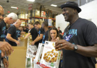 Hornets owner Michael Jordan and team pack food boxes for Florence victims