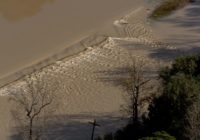 Water covers road near East Fork of San Jacinto River as flooding peaks