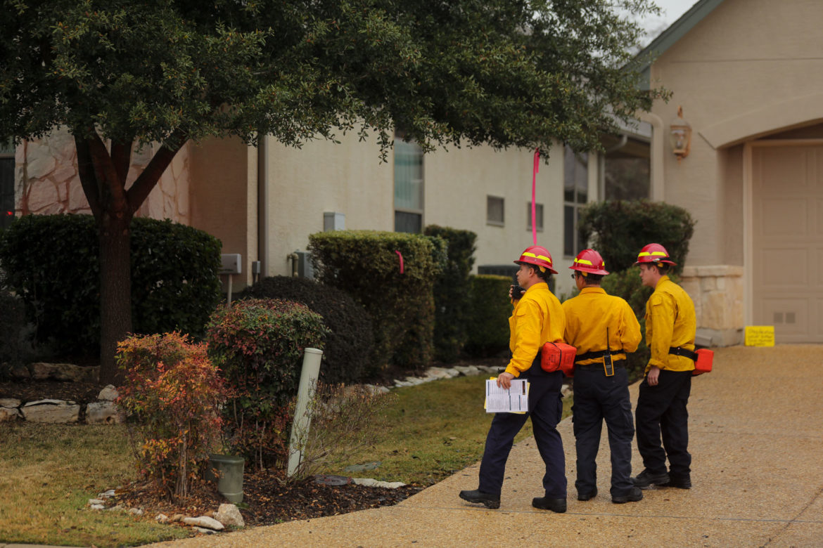 Firefighters survey a scene during the simulated training session. 