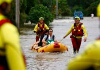 Australian leader tours floods where 2 men reported missing