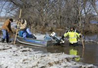 Midwest flooding forces evacuations, closing of road, river