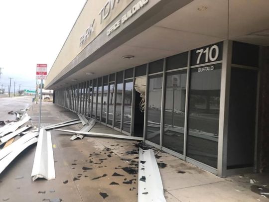 Hurricane Harvey debris from the uptown post office damaged the building across Buffalo Street.