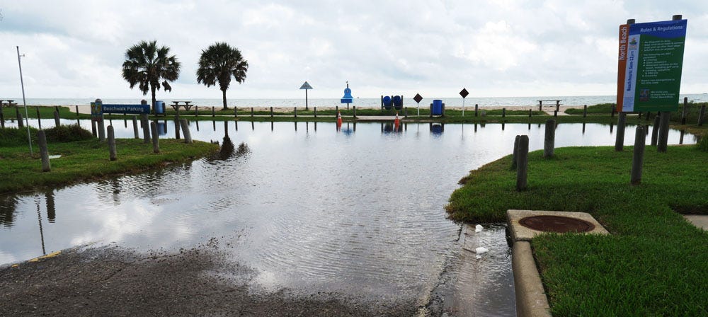 Gulfspray Avenue on North Beach is flooded with saltwater that backed up through the stormwater pipes after a high tide on Oct. 20.