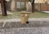 Major hail storm pushes trash can down the street in amusing video