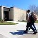 Students pass by the Heldenfels Administration Building on Wednesday, Feb. 17, 2016, at Del Mar College in Corpus Christi.