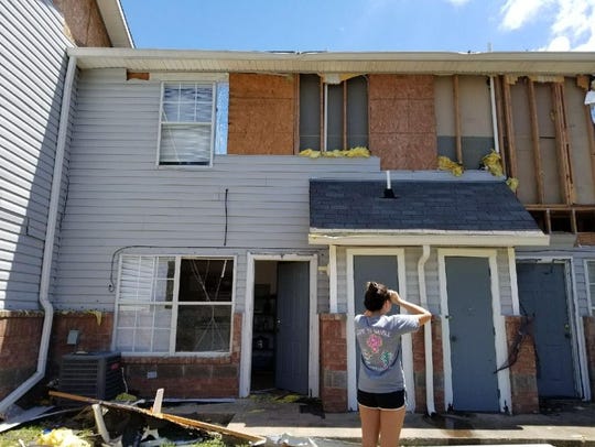 Jessica Hernandez surveys the damage to her apartment after returning to Rockport following Hurricane Harvey. The apartment complex was a total loss and she was unable to retrieve many items from her home.