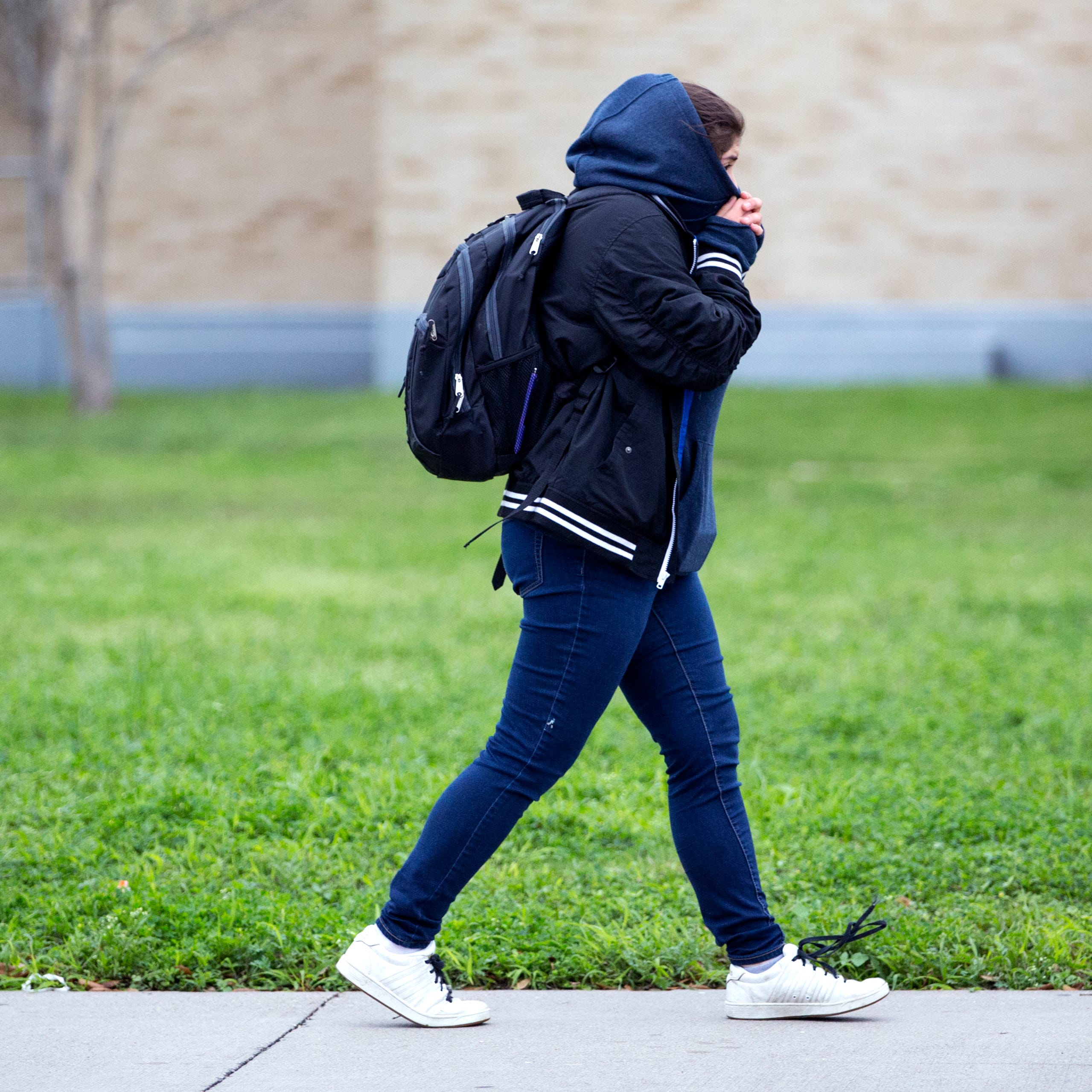 A Ray High School student walks to school on Monday, March 4, 2019. After a strong cold front moved into the Corpus Christi area Sunday afternoon, temperatures were in the upper 30s Monday morning with wind chills in the 20s. 