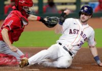 Angels beat Astros 12-5 to split DH caused by hurricane