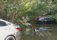 At least 5 cars stuck in Olmos Creek after Orsinger Lane floods