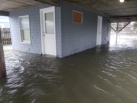 Dune collapses, roads and ferries close as flooding, high winds impact NC coast