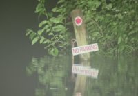 West Fork San Jacinto River  floods I-69 frontage road which is now closed in both directions