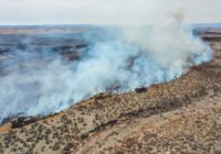 Firefighters face difficult weather conditions as they battle the largest wildfire in Texas history