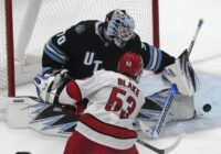 Utah scores 3 goals in 2 1/2 minutes in 3rd, Vejmelka has 49 saves in 4-1 win over Hurricanes