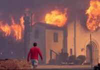 Wildfires burn out of control across Los Angeles area and kill 5 as thousands flee homes